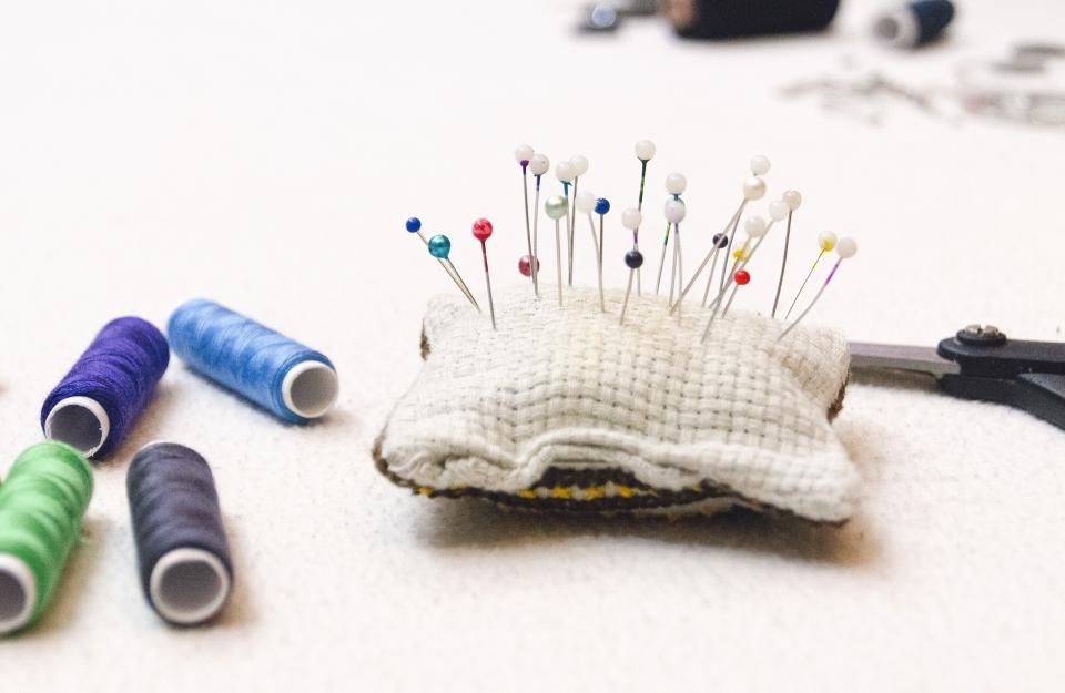 Pincushion and spools of thread